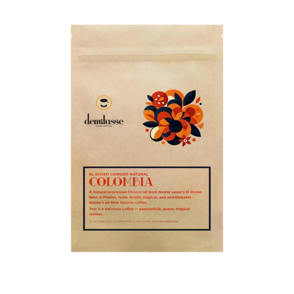 A stand-up kraft paper coffee bag from demlasse, featuring a colorful floral graphic in orange, black, and red, and a label for 'El Diviso Chigroso Natural Colombia' on a white background. – Demitasse main product