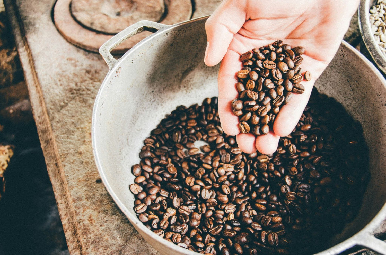 Coffee beans on a steel wok