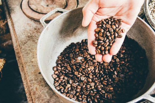 Coffee beans on a steel wok
