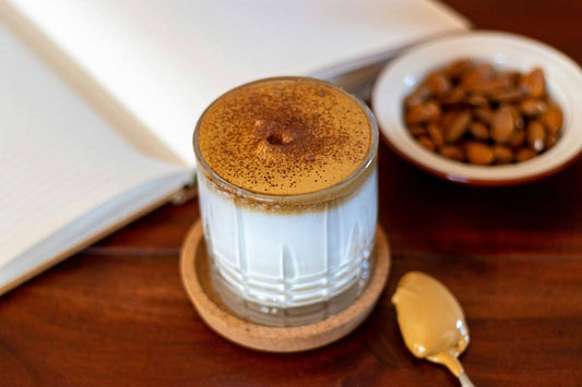 Cup of coffee sitting on a wooden plate