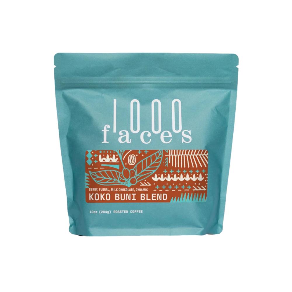 Teal coffee bag with '1000 Faces' branding and 'Kuko Buny Blend' text on a white background – 1000Faces Coffee main product