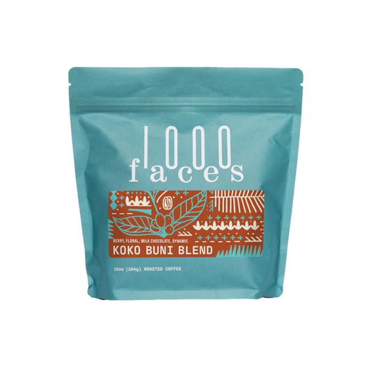 Teal coffee bag with '1000 Faces' branding and 'Kuko Buny Blend' text on a white background