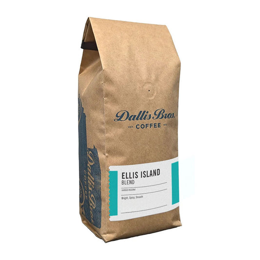 A brown kraft paper bag of Dallin Bias Coffee's Ellis Island Blend, featuring a white and teal label on the front, set against a plain white background.