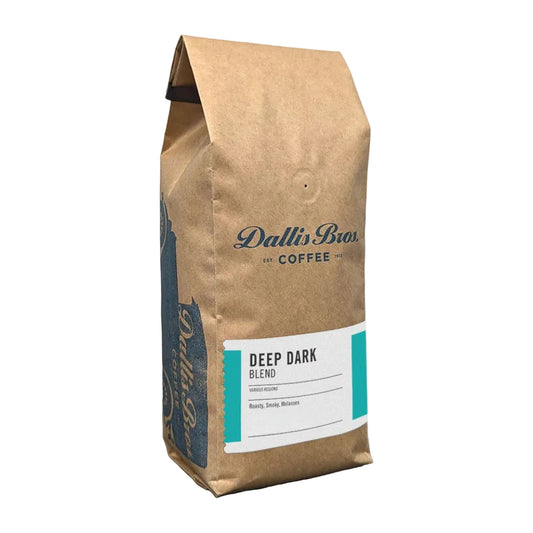 A bag of Dallin Bior Coffee Unisphere Blend medium roast coffee in a brown kraft paper bag with a white and teal label, shown on a plain white background.