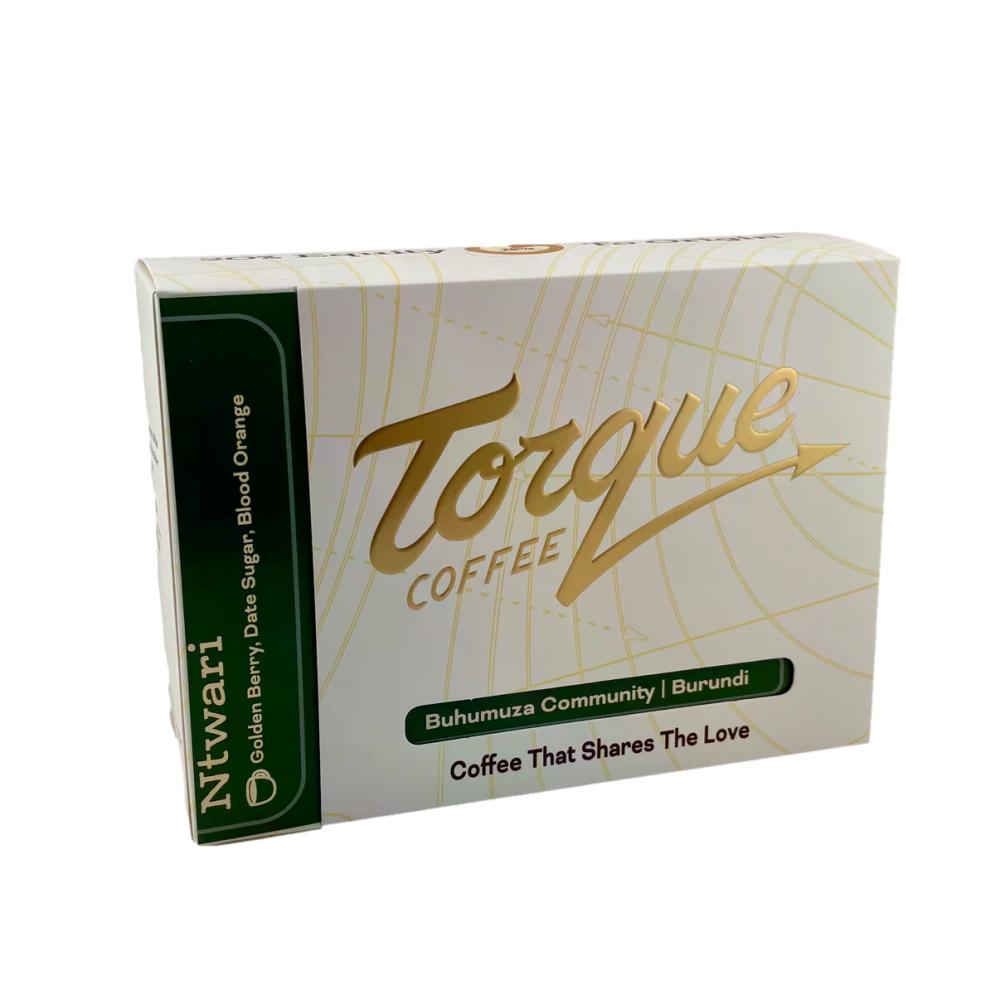 A box of Ntwari Torque Coffee, featuring a white and gold design with green accents, photographed on a clean white background. – Torque Coffees main product